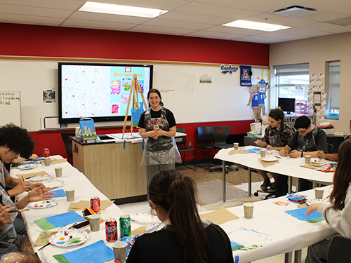 Students participate in a therapeutic painting session