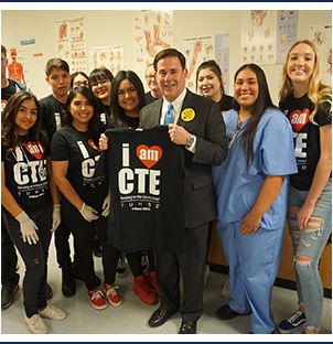 Group of high school students wearing TUHSD CTE t-shirts